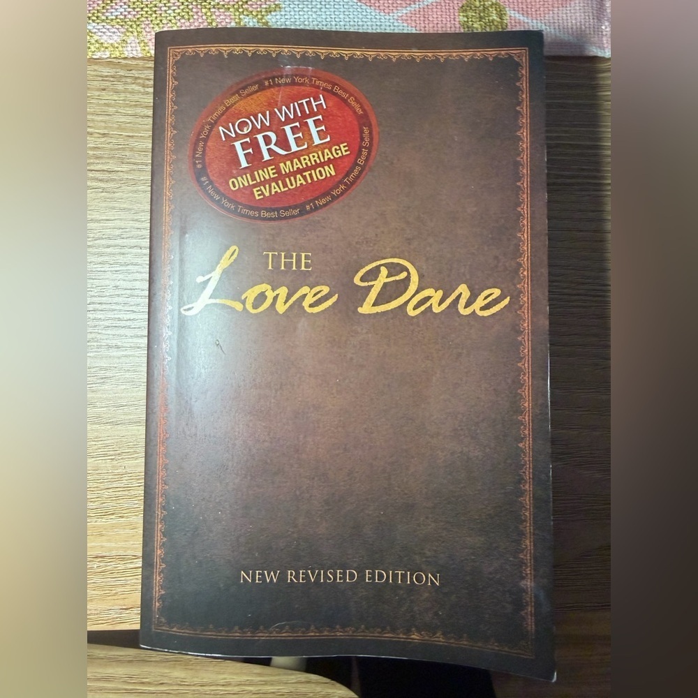 The Love Dare by Alex Kendrick. It is a Christian devotional book